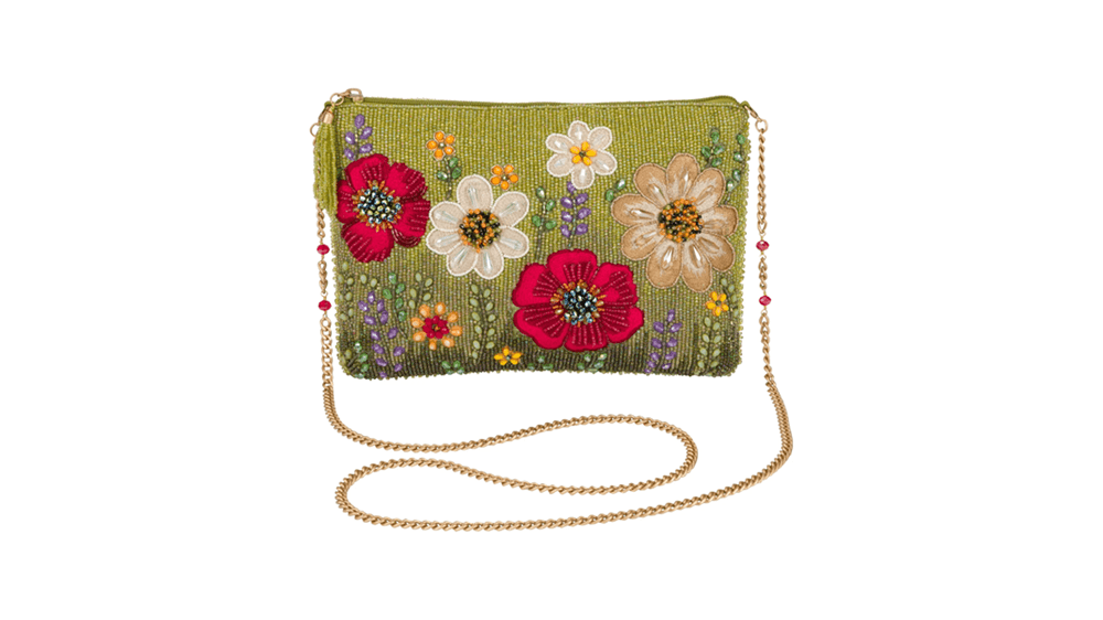 A floral beaded purse with red, white, and cream flowers.