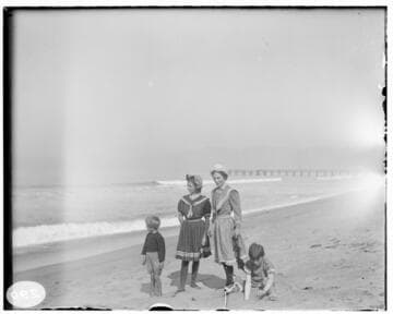 Two women and two young boys at the beach
