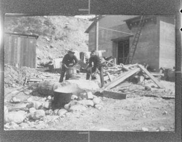 Two men, Norwood and Crawford, washing clothes