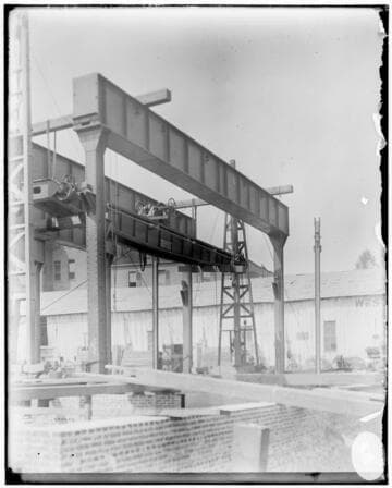 A construction crew working on the Fourth Street General Office building