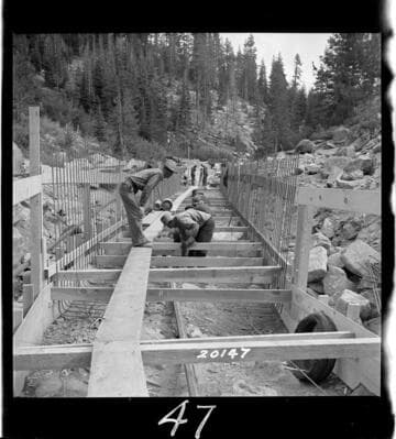 Placing reinforcing steel in foundation mat for 42" pipe extension prior to pouring concrete