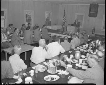 Luncheon with man speaking at podium