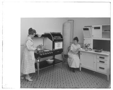 Hughes range and water heater in studio kitchen with Hoyt