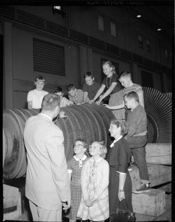 Grade school children on a tour through a steam generation power plant