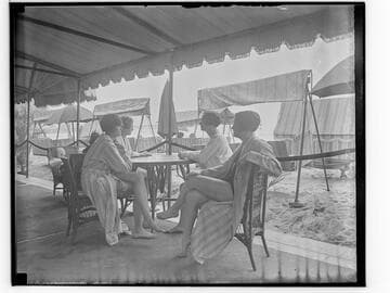 Swim team at a table at the Club Casa del Mar, Santa Monica, California