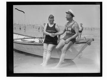 Swim meet winner shaking hands with lifeguard at breakwater Dedication, Santa Monica