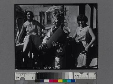 Clown holding a giant firecracker, Venice Beach, California