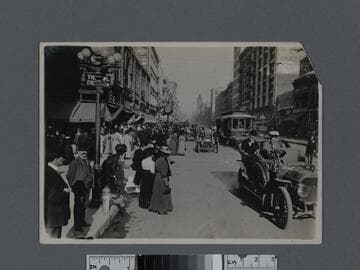 South Broadway street scene with automobiles and horse-drawn carriages, Los Angeles