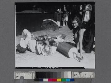 Clown resting on a giant firecracker, Venice Beach, California