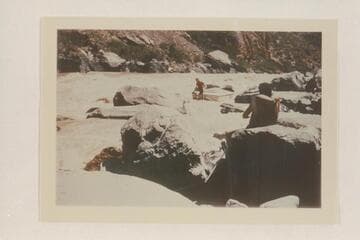 Lining a Nevills sadiron at Vulcan Rapid.  Nevills sits on the stern.  Garth Marston strains on the stern line
