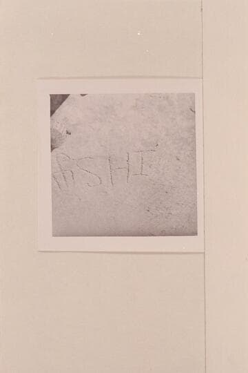 Marking on sloping slickrock near spring at TSE AH TOH