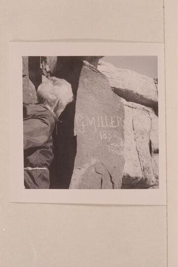 Mary Abbott looks at the G. M. Miller inscription in the gorge below the Navajo Mountain Trading Post