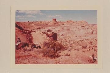 Dropping down into basin of Nasja Creek from the west.  The formation at upper center appears in Marston photo 609 SJRR 5.28.8.  Buck Whitehat is at left.  Nasja Begay is lower right