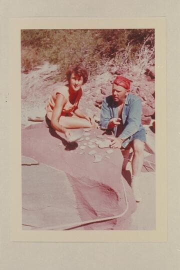 Joyce Hamilton and Bill Belknap examine pottery; camp above Unkar Rapid