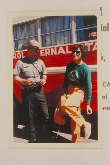 Ranger and Mrs. Jack Currey checking arrival of brass for ceremony at Foot of Split Mountain