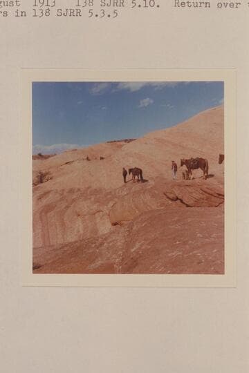 Leading the stock along a ledge in the bald rock crossing from Little Junction Creek to Bald Rock Creek