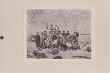 Kneeling at left is Owen Clark, Rodin is wearing white shirt and seated, LaRue stands third from left, Woodbury wears dark cap and stands near right and Dodge is seated in back and second from right