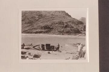 The "BOO" in drydock after hitting island at Granite Falls.  Joe Desloge is near the boat, the "Sweet Chariot" is right and the two outboard boats are left
