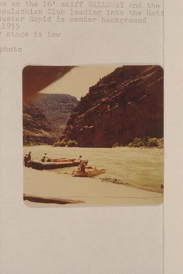 Lug Larsen on the 16' skiff "Galloway" and the numerous members of the Appalachian Club loading into the Hatch pontoon.  Lower Disaster Rapid is center background.  The water stage is low