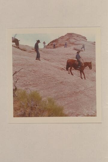 Dan Lehi rides down the slick rock and Toby Owl leads his mule while the dudes run cameras.  The trail is between Bald Rock Creek and Nasja Creek
