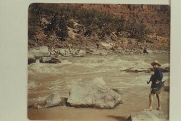 Lloyd Shearer standing on left bank at upper end of Upper Disaster Falls