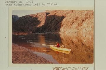 Harvey Butchart crossing the river at Diamond Creek