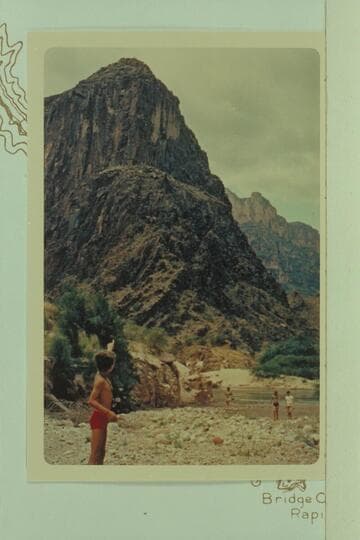 Steve Lamb points out the monument built on top of the point above Separation, left bank