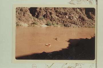 Harvey Butchart ferrying Doc Ellis across the river 1/4 mile above Diamond Creek