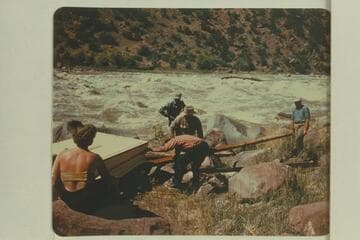 Portage at Hells Half Mile.  Fern Frost at left; Kent in checked shirt;  Frank Wright with straw hat; Alf Frost behind Frank; Wayne McConkie at right