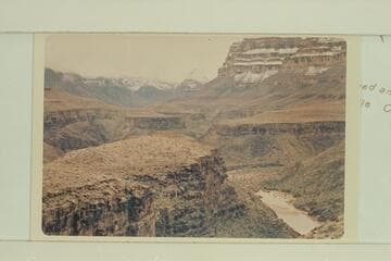 Down to mouth of 220 Mile Canyon.  A snow-covered Diamond Peak in distance