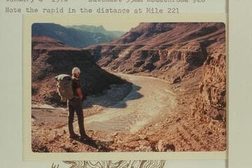 Jorgen Visbak looks down to the mouth of Granite Spring Canyon and Granite Spring Rapid which heads at Mile 220.4