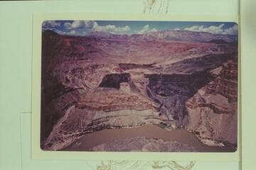 Whitmore Wash at left.  Queantoweap Valley at top with the cinder cone at upper right.  The Whitmore trail drops off the rim at center and crosses the basalt to end on the bech at lower right