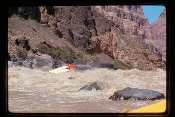 "Wee Red" climbs Vulcan Rapids