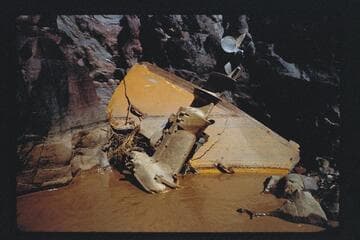 Transom and motor from Harris-Brennan boat; below Hance