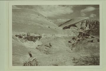 Mile 35.3, east side.  Two lower sets of stock trail steps, lower left and upper right