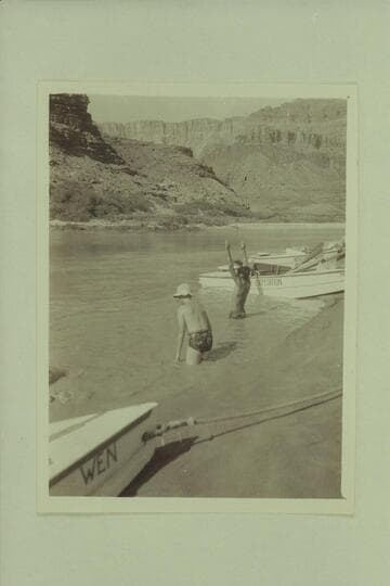 Bruce Wilson and Garth Marston swimming at the foot of the Tanner Trail