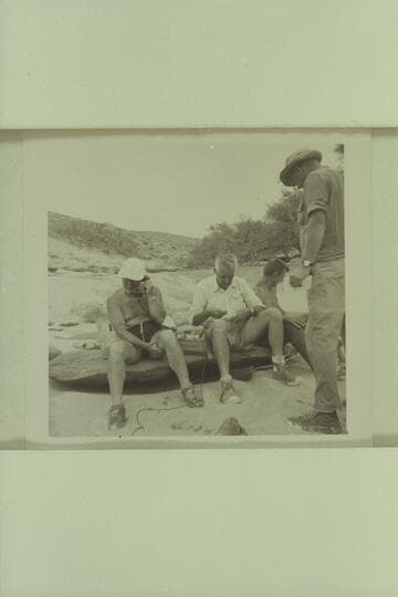 Les Gear holds the aerial while the attempt is made to get communication with the Rim.  Dock Marston; John Doerr; Doc [sic] Hill; Russ Haverick.  Lower end of Unkar Rapid