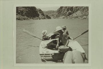 Nevills at the outboard motor in Narrow Canyon