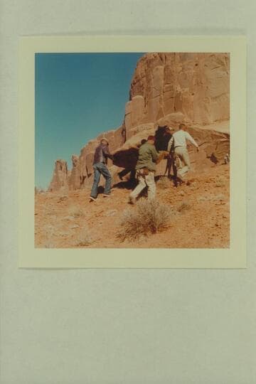Disney special effects crew carrying rock to location at Park Avenue in the Arches National Monument.  Filming of "The Colorado River Story."
