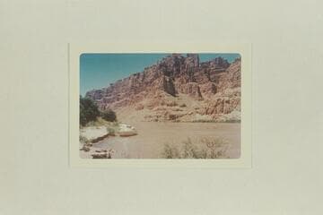 Boats moored at left bank above and opposite Range Canyon.  Mile 205.3