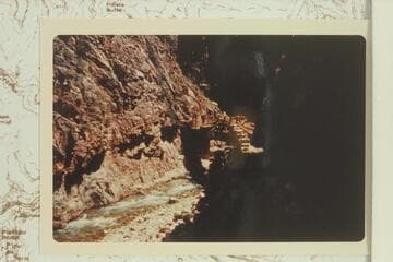 Aluminum bridge in The Box of Bright Angel Creek wrecked and loaded with log jam by flood of 1966, Dec