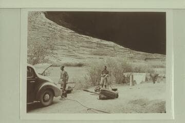 Unloading the punt near Moab at end of traverse of the Dolores River.  Pres Walker and Margaret Marston