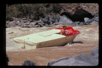 "Wee Red" clears rocks and climbs Vulcan Rapids