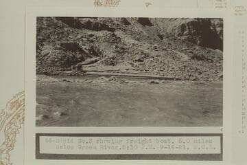 Rapid #3 showing freight boat of the U. S. Geological Survey party, 5.0 miles below the Green River.  Rapid #3 heads at Mile 211.65 and drops 4' in .15 miles