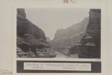 Down to Thirty-Mile Damsite from the upstream side of CoVe CAnyon.  The beach where Chenoweth Viewed the D. Julien inscription is in the shadow of the oVerhang at the left bank at lower margin