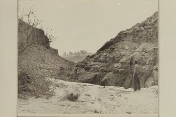 Kent Frost at the first drop into Red Lake Canyon or Butler Canyon.  The Land of the Standing Rocks across the Colorado in background