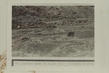 Ellsworth Kolb running the USGS flat-decked boat thru Rapid No. 2