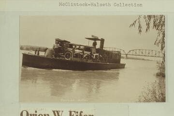 The ferry "Nellie T." in midstream of the Colorado River at Parker