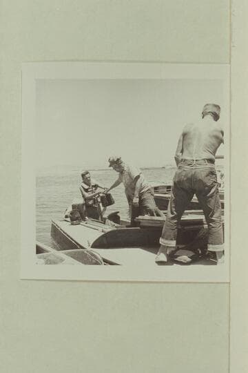 Unloading the sinking "Para Dox" at Boulder City:  Buzz Belknap, Doc Reed and Doc Hill