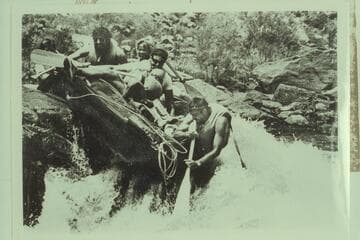 Colorado Outward Bound School paddlers strike the rock in mid-River in Winnie's Rapid; Mile 240.5, Canyon of Ladore